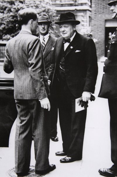 Churchill leaves Downing Street for Buckingham Palace, to take King George VI a letter from the US President, 1941 by English Photographer